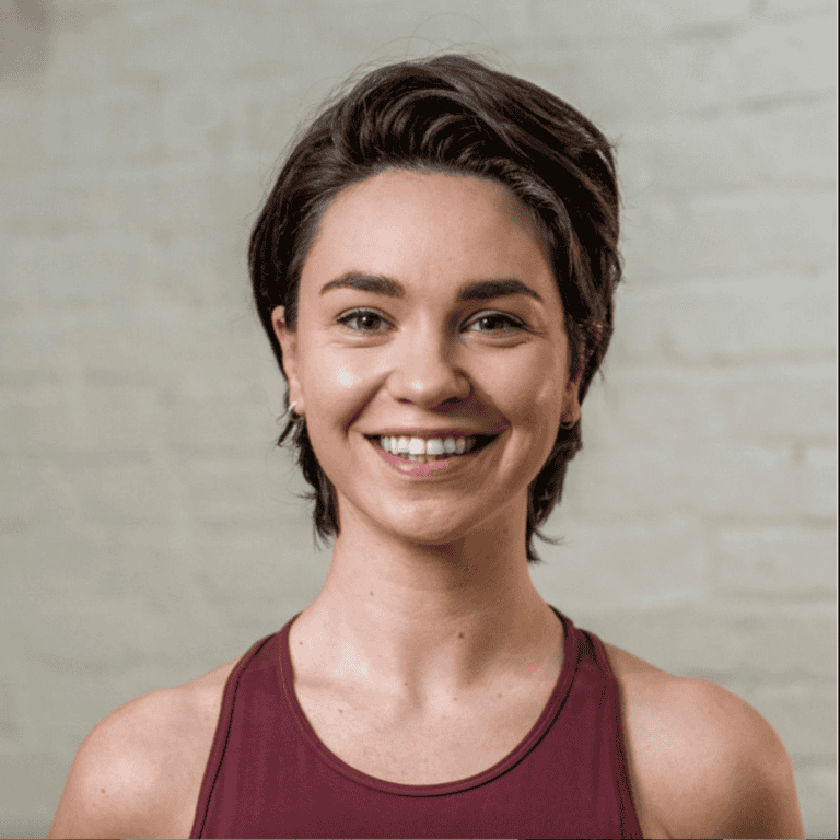 young smiling woman with dark brown hair, called Abbie, yoga & Pilates teacher at Shine at The Hollies