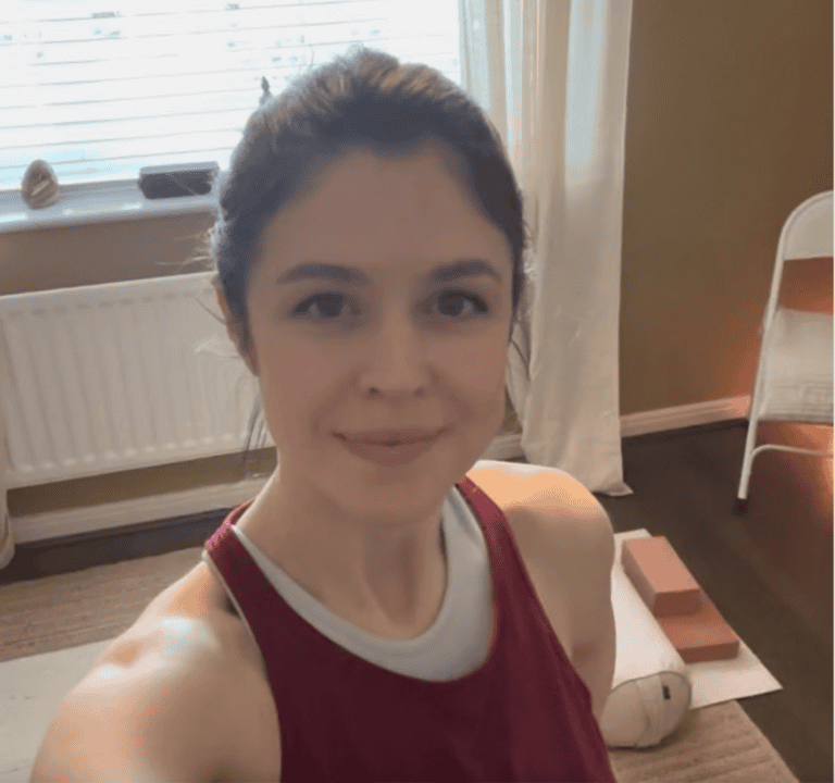 young smiling woman with dark brown hair, called Hannah, yoga & Pilates teacher at Shine at The Hollies